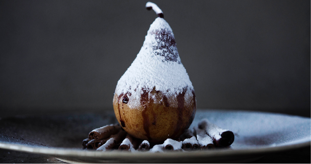 Pear on cinnamon sticks covered with Icing Sugar